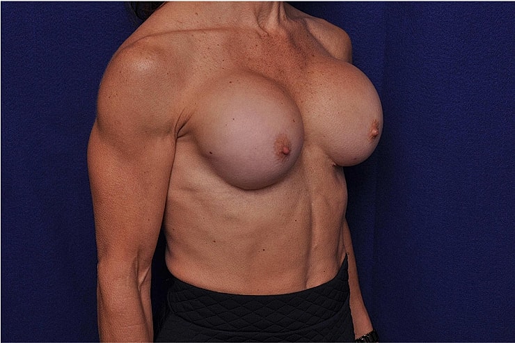 Female figure with muscular physique and breasts.