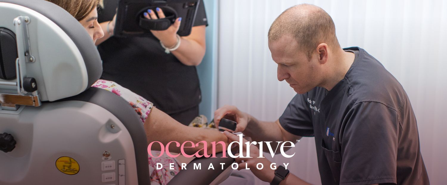 Dermatologist examining a patient's skin condition.