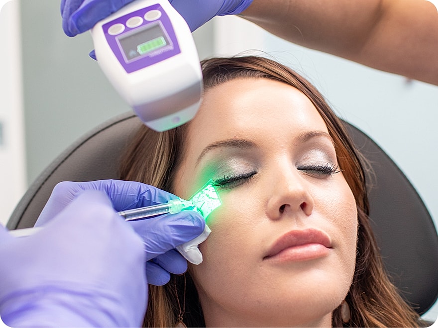 Dermatologist examining a patient's skin.