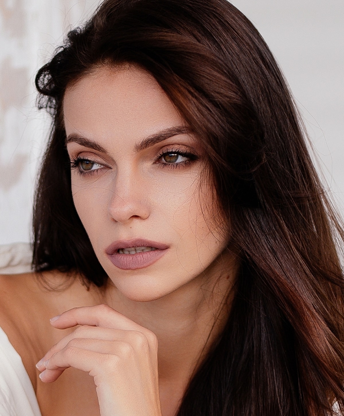 Woman with blonde hair in soft sunlight.