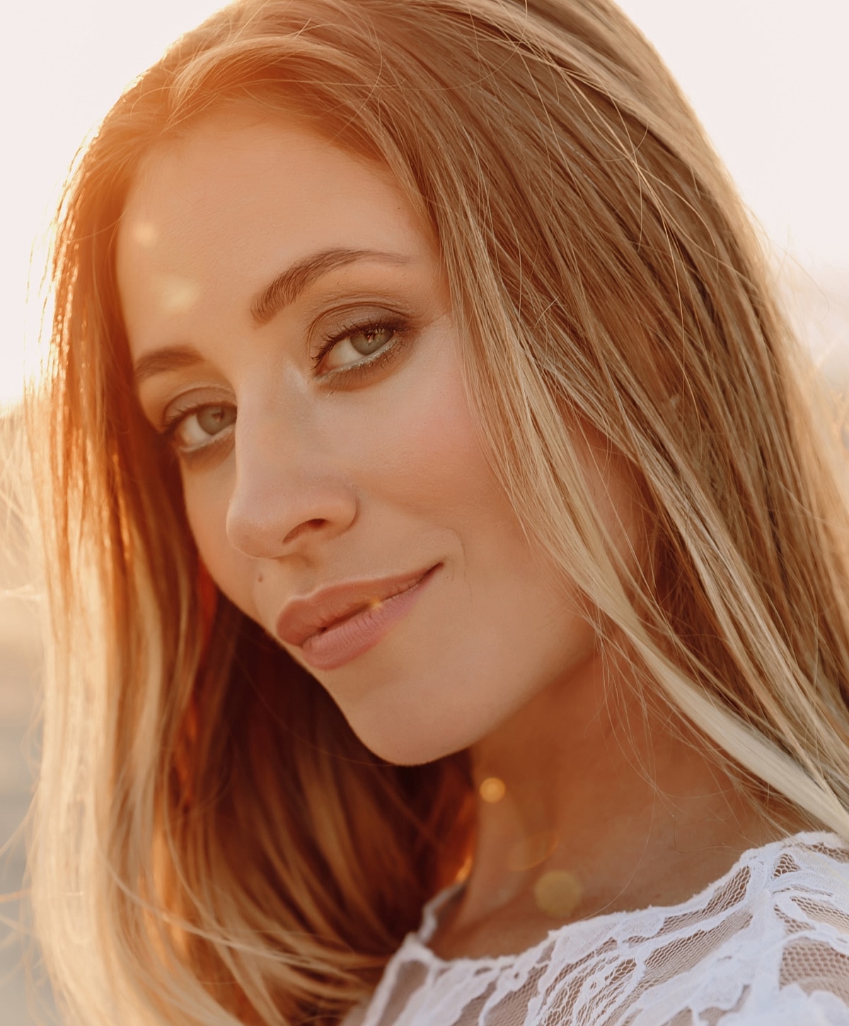Close-up of a woman with long, flowing hair.
