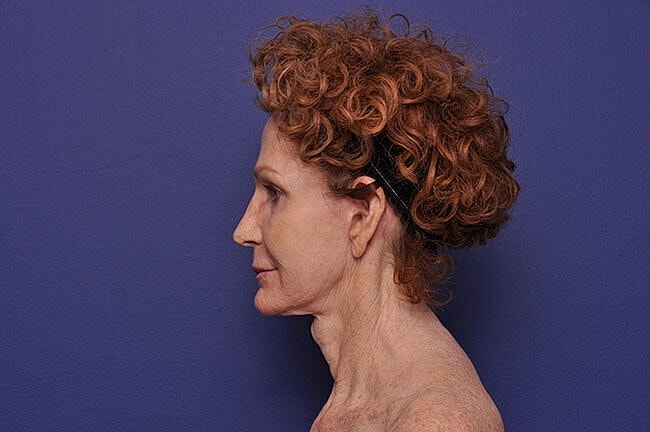 Profile view of woman with curly hair.