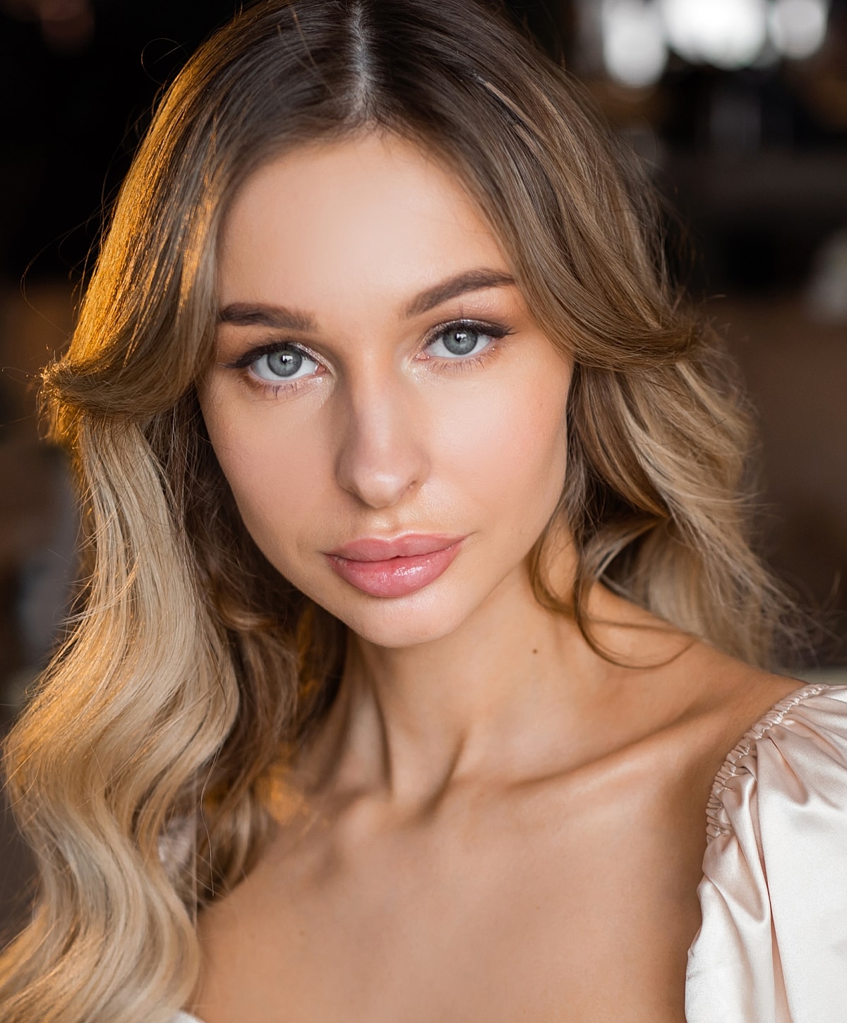 Portrait of a woman with wavy hair.