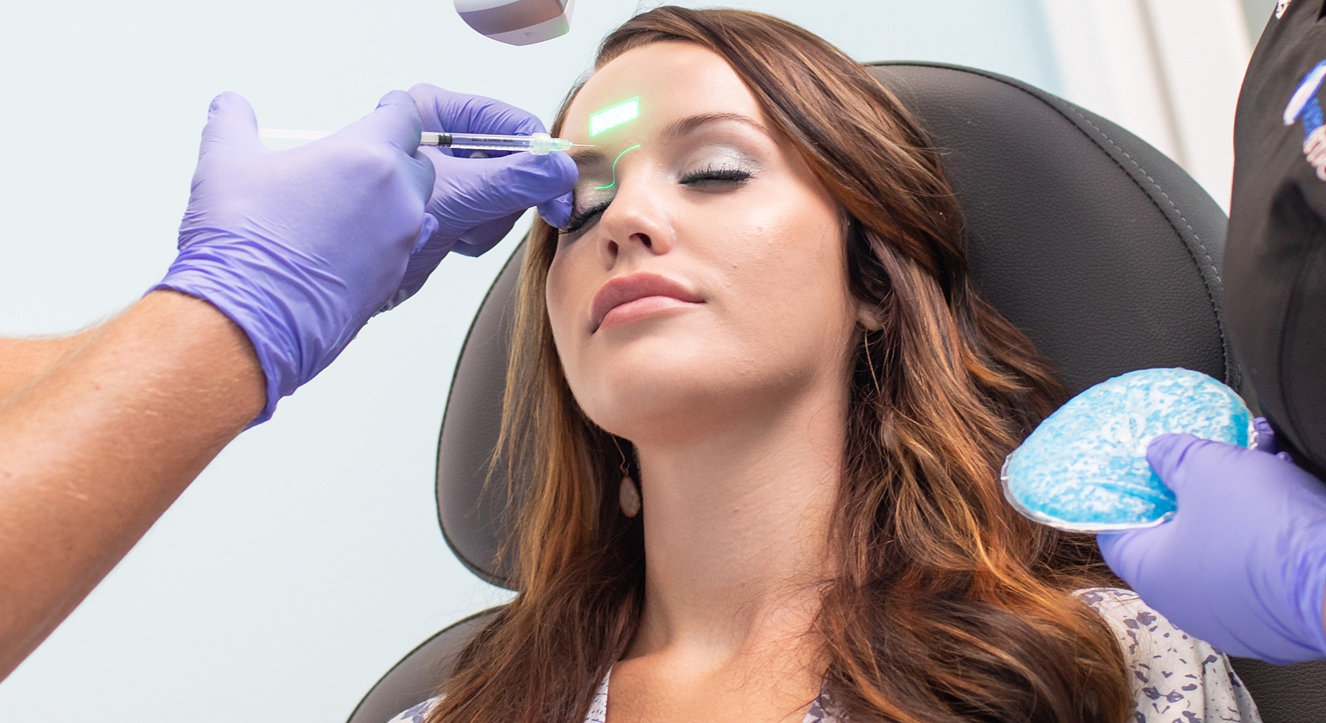 Patient receiving cosmetic treatment in medical setting.