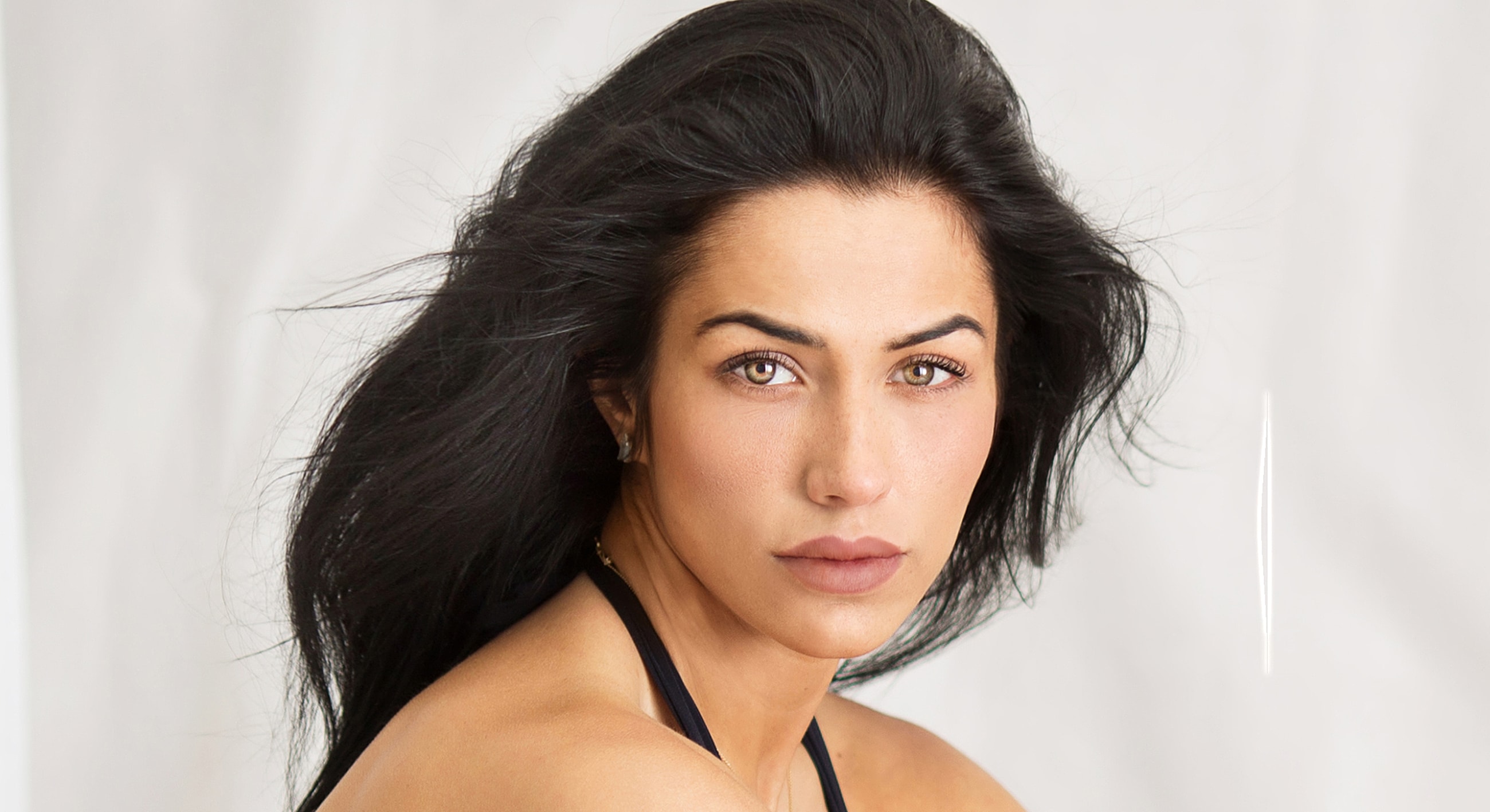 Woman with blonde hair and blue eyes.